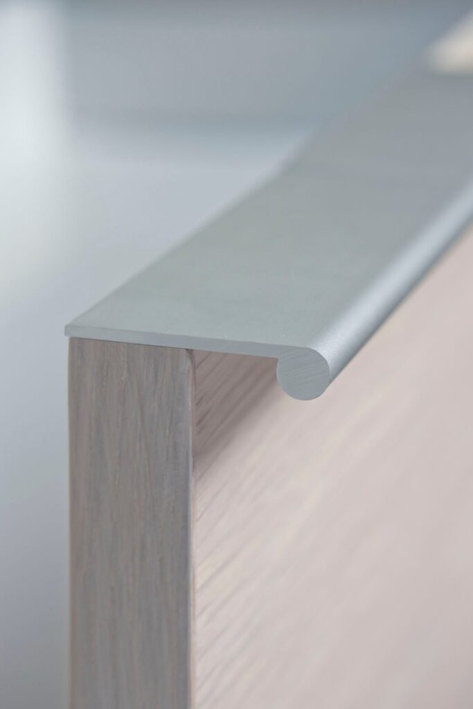 CONTINUOUS DRAWER PULLS